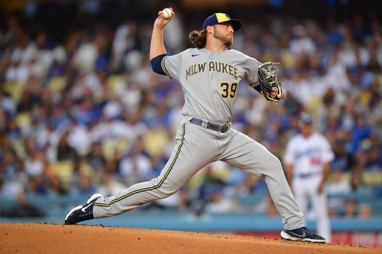 Aug 23, 2022; Los Angeles, California, USA; Milwaukee Brewers starting pitcher Corbin Burnes (39) throws against the Los Angeles Dodgers during the first inning at Dodger Stadium. Mandatory Credit: Gary A. Vasquez-USA TODAY Sports