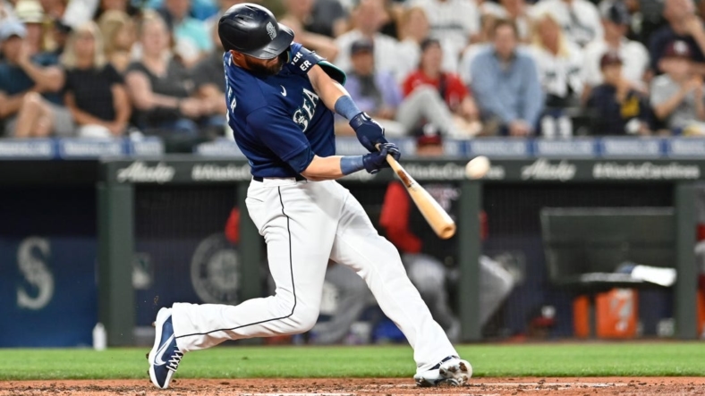 Aug 23, 2022; Seattle, Washington, USA; Seattle Mariners right fielder Mitch Haniger (17) hits a two-run home run against the Washington Nationals during the fourth inning at T-Mobile Park. Mandatory Credit: Steven Bisig-USA TODAY Sports