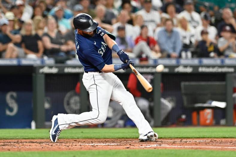 Aug 23, 2022; Seattle, Washington, USA; Seattle Mariners right fielder Mitch Haniger (17) hits a two-run home run against the Washington Nationals during the fourth inning at T-Mobile Park. Mandatory Credit: Steven Bisig-USA TODAY Sports