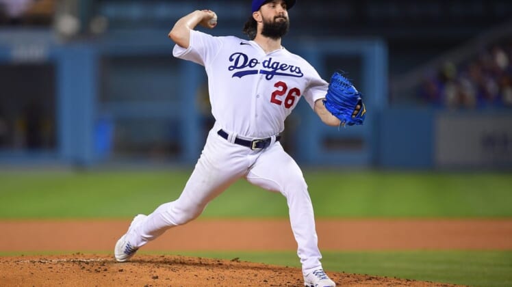 Aug 23, 2022; Los Angeles, California, USA; Los Angeles Dodgers starting pitcher Tony Gonsolin (26) throws against the Milwaukee Brewers during the third inning at Dodger Stadium. Mandatory Credit: Gary A. Vasquez-USA TODAY Sports