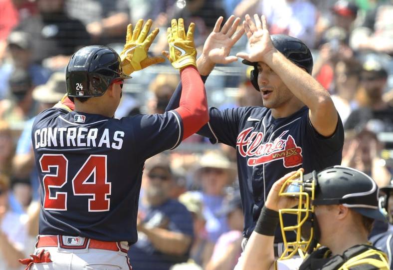 Aug 24, 2022; Pittsburgh, Pennsylvania, USA;  Atlanta Braves first baseman Matt Olson (28) greets catcher William Contreras (24) crossing home plate on a two run home run against the Pittsburgh Pirates during the second inning at PNC Park. Mandatory Credit: Charles LeClaire-USA TODAY Sports