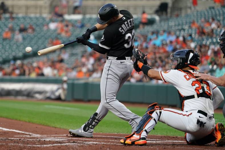 Aug 24, 2022; Baltimore, Maryland, USA; Chicago White Sox outfielder Gavin Sheets (32) hits a two run RBI single in the first inning against the Baltimore Orioles at Oriole Park at Camden Yards. Mandatory Credit: Mitch Stringer-USA TODAY Sports