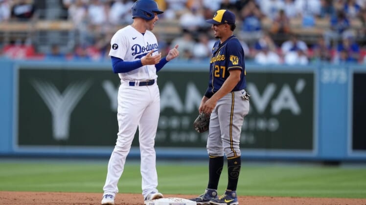 Aug 24, 2022; Los Angeles, California, USA; Los Angeles Dodgers first baseman Freddie Freeman (5) talks with Milwaukee Brewers shortstop Willy Adames (27) in the first inning at Dodger Stadium. Mandatory Credit: Kirby Lee-USA TODAY Sports