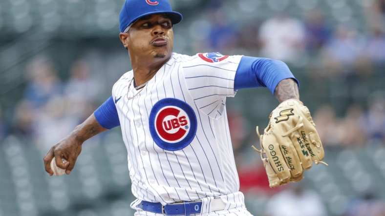 Aug 25, 2022; Chicago, Illinois, USA; Chicago Cubs starting pitcher Marcus Stroman (0) throws a pitch against the St. Louis Cardinals during the first inning at Wrigley Field. Mandatory Credit: Kamil Krzaczynski-USA TODAY Sports