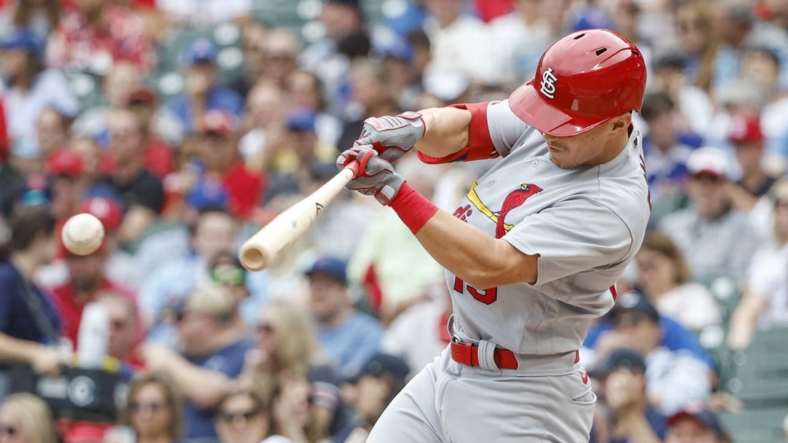 Aug 25, 2022; Chicago, Illinois, USA; St. Louis Cardinals second baseman Tommy Edman (19) singles against the Chicago Cubs during the first inning at Wrigley Field. Mandatory Credit: Kamil Krzaczynski-USA TODAY Sports