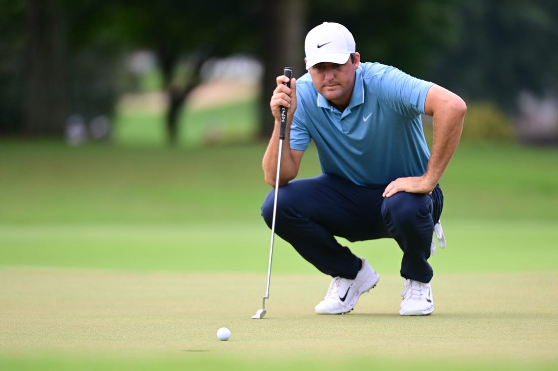 Aug 25, 2022; Atlanta, Georgia, USA; Scott Scheffler lines a putt on the 1st green during the first round of the TOUR Championship golf tournament. Mandatory Credit: Adam Hagy-USA TODAY Sports