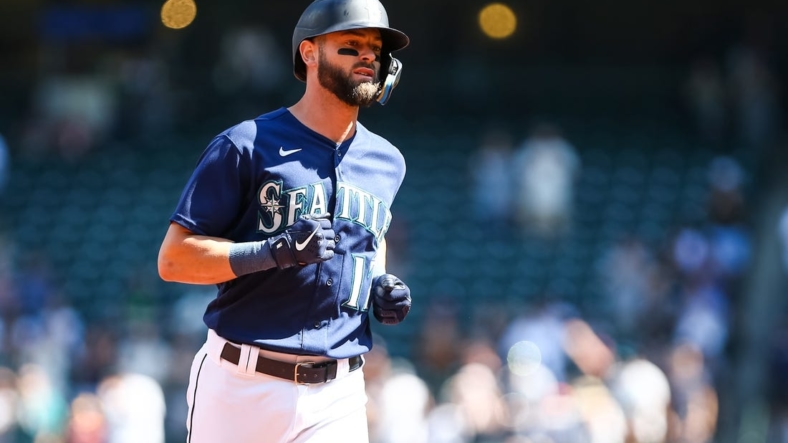 Aug 25, 2022; Seattle, Washington, USA; Seattle Mariners right fielder Mitch Haniger (17) rounds the bases after hitting a three-run home run against the Cleveland Guardians during the first inning at T-Mobile Park. Mandatory Credit: Lindsey Wasson-USA TODAY Sports