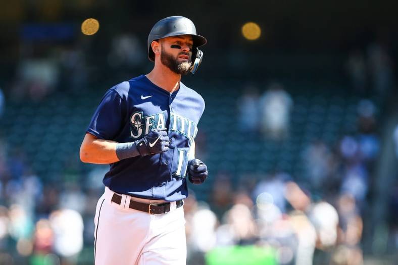 Aug 25, 2022; Seattle, Washington, USA; Seattle Mariners right fielder Mitch Haniger (17) rounds the bases after hitting a three-run home run against the Cleveland Guardians during the first inning at T-Mobile Park. Mandatory Credit: Lindsey Wasson-USA TODAY Sports