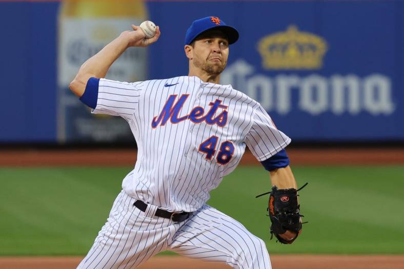 Aug 25, 2022; New York City, New York, USA; New York Mets starting pitcher Jacob deGrom (48) delivers a pitch  during the first inning against the Colorado Rockies at Citi Field. Mandatory Credit: Vincent Carchietta-USA TODAY Sports