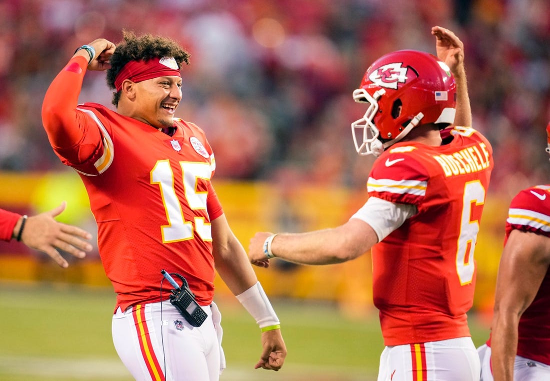 Aug 25, 2022; Kansas City, Missouri, USA; Kansas City Chiefs quarterback Patrick Mahomes (15) celebrates with quarterback Shane Buechele (6) after a touchdown against the Green Bay Packers during the first half at GEHA Field at Arrowhead Stadium. Mandatory Credit: Jay Biggerstaff-USA TODAY Sports