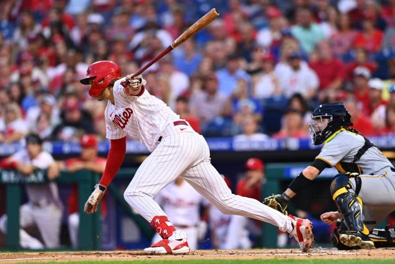 Aug 26, 2022; Philadelphia, Pennsylvania, USA; Philadelphia Phillies third baseman Alec Bohm (28) hits an infield single against the Pittsburgh Pirates in the first inning at Citizens Bank Park. Mandatory Credit: Kyle Ross-USA TODAY Sports
