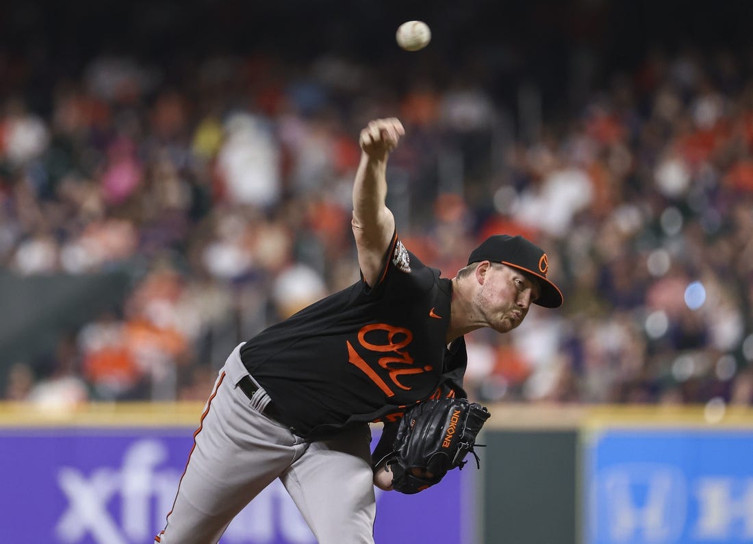 Aug 26, 2022; Houston, Texas, USA; Baltimore Orioles starting pitcher Kyle Bradish (56) delivers a pitch during the second inning against the Houston Astros at Minute Maid Park. Mandatory Credit: Troy Taormina-USA TODAY Sports