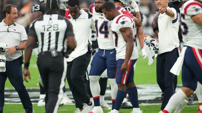 Aug 26, 2022; Paradise, Nevada, USA; New England Patriots wide receiver Ty Montgomery (14) is helped off the field after sustaining an injury during a preseason game against the Las Vegas Raiders at Allegiant Stadium. Mandatory Credit: Stephen R. Sylvanie-USA TODAY Sports