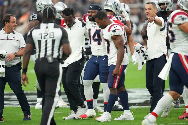 Aug 26, 2022; Paradise, Nevada, USA; New England Patriots wide receiver Ty Montgomery (14) is helped off the field after sustaining an injury during a preseason game against the Las Vegas Raiders at Allegiant Stadium. Mandatory Credit: Stephen R. Sylvanie-USA TODAY Sports