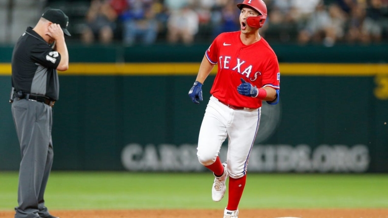 Aug 26, 2022; Arlington, Texas, USA; Aug 26, 2022; Arlington, Texas, USA; (Editors Notes: Caption Correction) Texas Rangers designated hitter Mark Mathias (9) celebrates while rounding the bases after hitting a two-run home run during the third inning against the Detroit Tigers at Globe Life Field. Mandatory Credit: Andrew Dieb-USA TODAY Sports