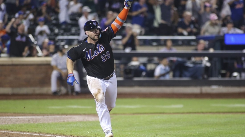 Aug 26, 2022; New York City, New York, USA; New York Mets first baseman Pete Alonso (20) celebrates after hitting a walk-off single in the ninth inning against the Colorado Rockies at Citi Field. Mandatory Credit: Wendell Cruz-USA TODAY Sports