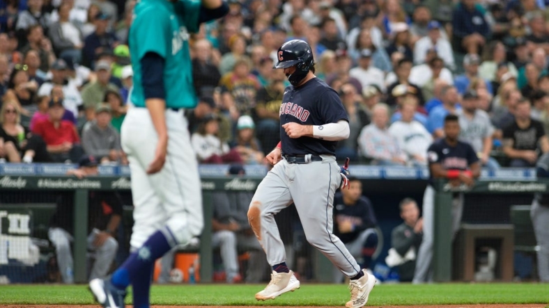 Aug 26, 2022; Seattle, Washington, USA; Cleveland Guardians catcher Austin Hedges (17) scores a run off a sacrifice fly ball hit by left fielder Steven Kwan (38) (not pictured) during the third inning against the Seattle Mariners at T-Mobile Park. Mandatory Credit: Steven Bisig-USA TODAY Sports