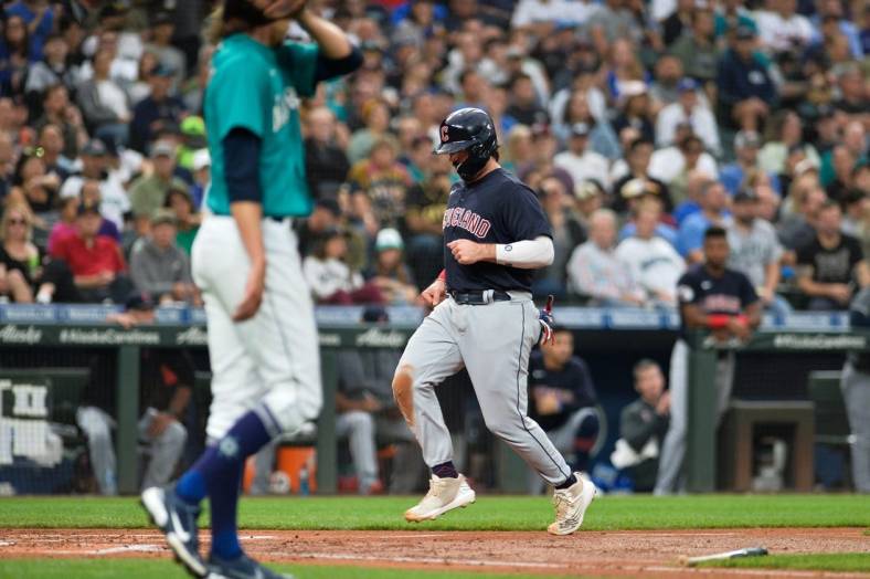 Aug 26, 2022; Seattle, Washington, USA; Cleveland Guardians catcher Austin Hedges (17) scores a run off a sacrifice fly ball hit by left fielder Steven Kwan (38) (not pictured) during the third inning against the Seattle Mariners at T-Mobile Park. Mandatory Credit: Steven Bisig-USA TODAY Sports