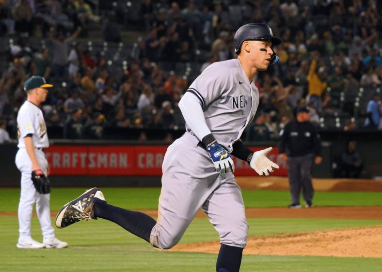 Aug 26, 2022; Oakland, California, USA; New York Yankees center fielder Aaron Judge (99) rounds the bases after hitting three-run home run off Oakland Athletics starting pitcher JP Sears (38) during the fifth inning at RingCentral Coliseum. Mandatory Credit: Kelley L Cox-USA TODAY Sports