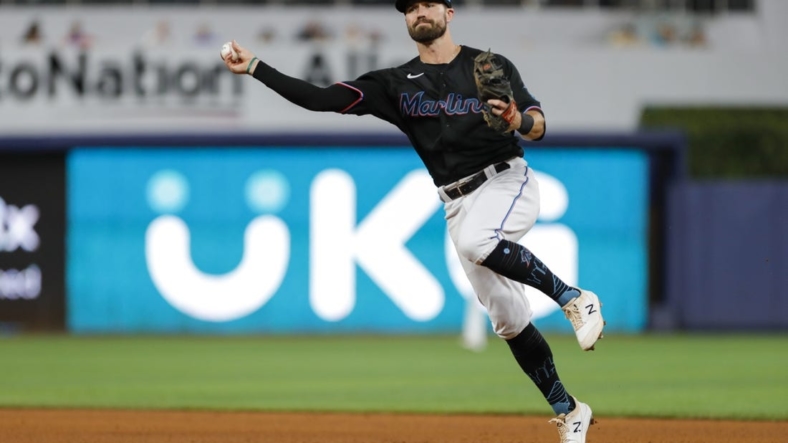 Aug 26, 2022; Miami, Florida, USA; Miami Marlins second baseman Jon Berti (5) throws to first base to retire Los Angeles Dodgers first baseman Freddie Freeman (not pictured) during the fifth inning at loanDepot Park. Mandatory Credit: Sam Navarro-USA TODAY Sports