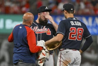 Aug 26, 2022; St. Louis, Missouri, USA;  Atlanta Braves relief pitcher Jackson Stephens (53) is checked on by a trainer and first baseman Matt Olson (28) after he was hit in the head by a line drive hit  by St. Louis Cardinals third baseman Brendan Donovan (not pictured) during the ninth inning at Busch Stadium. Mandatory Credit: Jeff Curry-USA TODAY Sports