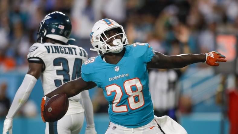 Aug 27, 2022; Miami Gardens, Florida, USA; Miami Dolphins running back Sony Michel (28) celebrates after scoring a touchdown during the first quarter against the Philadelphia Eagles at Hard Rock Stadium. Mandatory Credit: Sam Navarro-USA TODAY Sports