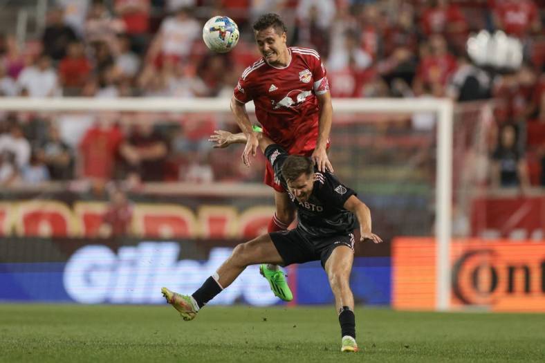 Aug 27, 2022; Harrison, New Jersey, USA; New York Red Bulls midfielder Aaron Long (33) fouls Inter Miami midfielder Indiana Vassilev (17) during the first half at Red Bull Arena. Mandatory Credit: Vincent Carchietta-USA TODAY Sports
