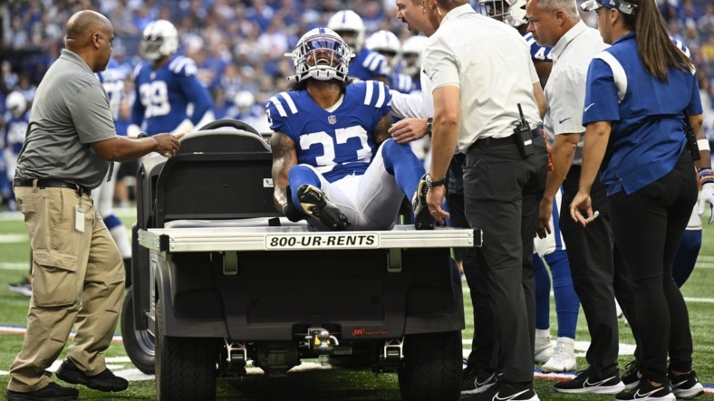 Aug 27, 2022; Indianapolis, Indiana, USA; Indianapolis Colts safety Armani Watts (33) is yells in pain with an injury early in the first quarter during the game against the Tampa Bay Buccaneers at Lucas Oil Stadium. Mandatory Credit: Marc Lebryk-USA TODAY Sports