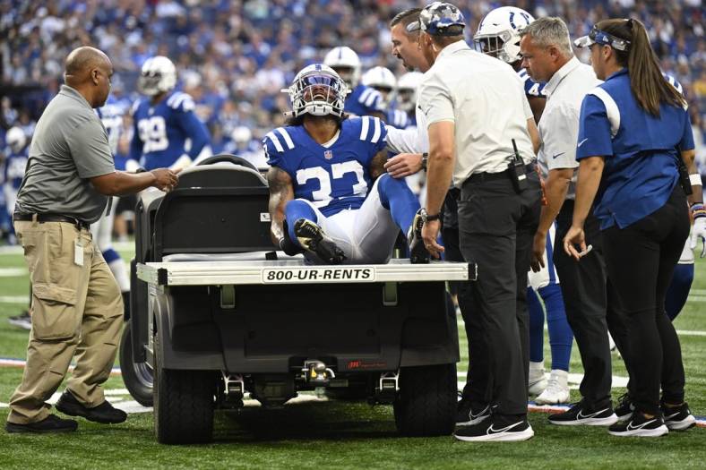 Aug 27, 2022; Indianapolis, Indiana, USA; Indianapolis Colts safety Armani Watts (33) is yells in pain with an injury early in the first quarter during the game against the Tampa Bay Buccaneers at Lucas Oil Stadium. Mandatory Credit: Marc Lebryk-USA TODAY Sports