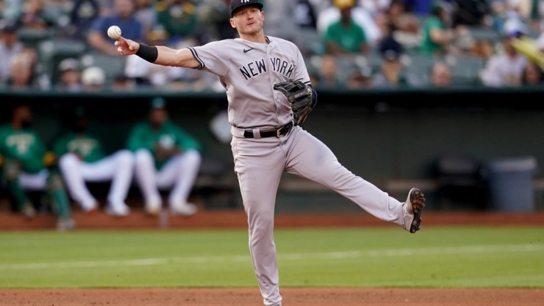 Aug 27, 2022; Oakland, California, USA; New York Yankees third baseman Josh Donaldson (28) throws to first to record an out against the Oakland Athletics in the fourth inning at RingCentral Coliseum. Mandatory Credit: Cary Edmondson-USA TODAY Sports