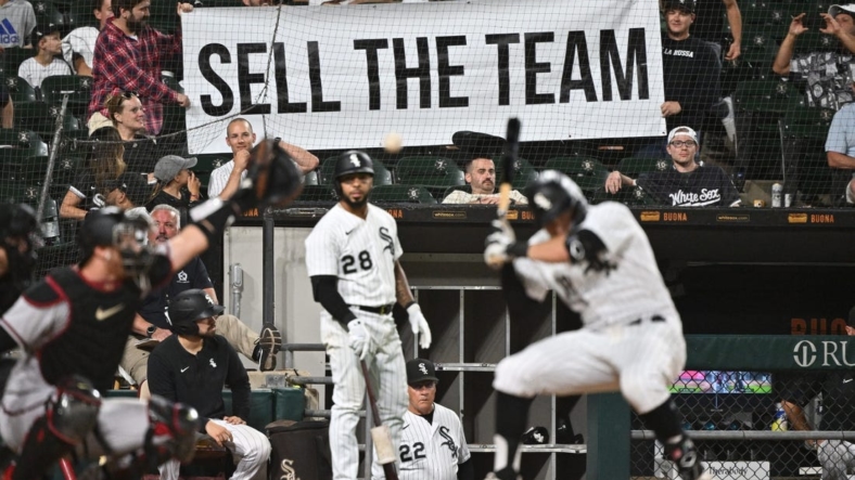 Aug 27, 2022; Chicago, Illinois, USA;  Frustrated Chicago White Sox fans hold up a sign urging to sell the team as outfielder AJ Pollock (18) bats in the ninth inning against the Arizona Diamondbacks at Guaranteed Rate Field. Arizona defeated Chicago 10-5. Mandatory Credit: Jamie Sabau-USA TODAY Sports