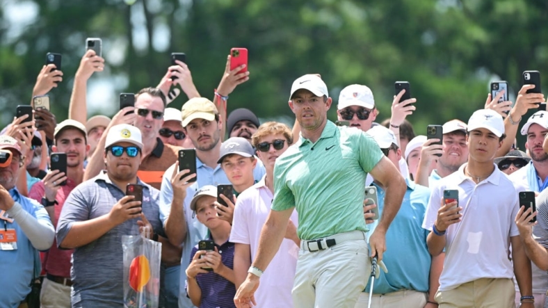 Aug 28, 2022; Atlanta, Georgia, USA; Rory McIlroy watches his chip attempt onto the 1st green during the final round of the TOUR Championship golf tournament. Mandatory Credit: Adam Hagy-USA TODAY Sports