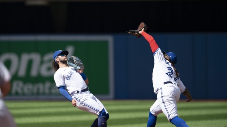 Aug 28, 2022; Toronto, Ontario, CAN; Toronto Blue Jays first baseman Vladimir Guerrero Jr. (27) catches a fly ball against the Los Angeles Angels during the third inning at Rogers Centre. Mandatory Credit: Nick Turchiaro-USA TODAY Sports