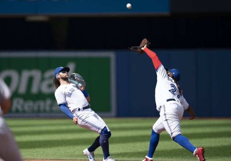 Aug 28, 2022; Toronto, Ontario, CAN; Toronto Blue Jays first baseman Vladimir Guerrero Jr. (27) catches a fly ball against the Los Angeles Angels during the third inning at Rogers Centre. Mandatory Credit: Nick Turchiaro-USA TODAY Sports