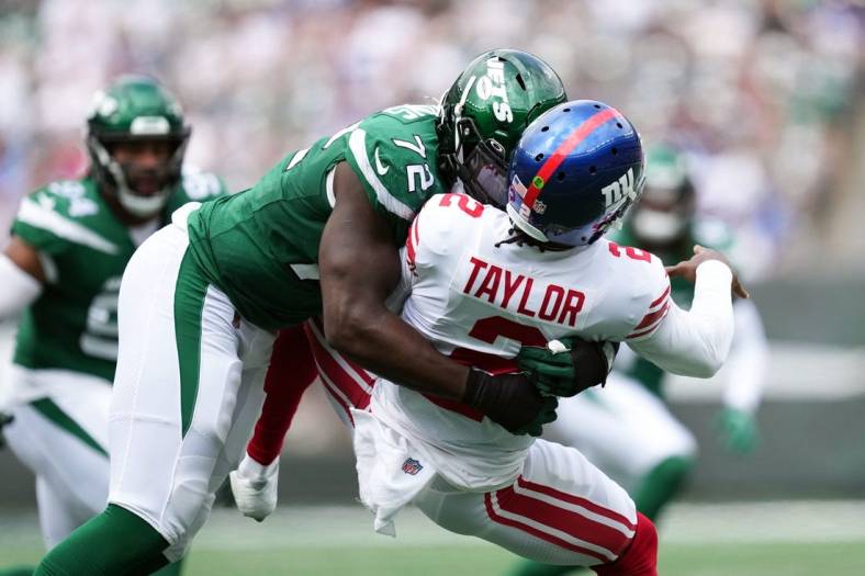 New York Jets defensive end Micheal Clemons (72) sacks New York Giants quarterback Tyrod Taylor (2) in the first half of a preseason game at MetLife Stadium on Sunday, August 28, 2022. Taylor was slow to get up and left the field soon after.

Nfl Giants Vs Jets Preseason Game Giants At Jets