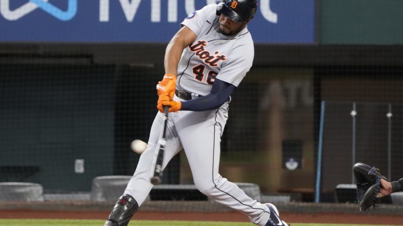 Aug 28, 2022; Arlington, Texas, USA; Detroit Tigers third baseman Jeimer Candelario (46) connects for a two-run home run against the Texas Rangers during the second inning at Globe Life Field. Mandatory Credit: Jim Cowsert-USA TODAY Sports