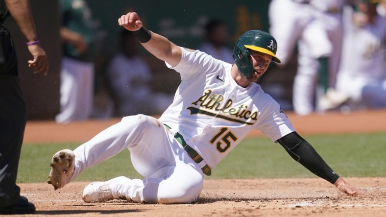 Aug 28, 2022; Oakland, California, USA; Oakland Athletics right fielder Seth Brown (15) scores a run against the New York Yankees in the first inning at RingCentral Coliseum. Mandatory Credit: Cary Edmondson-USA TODAY Sports