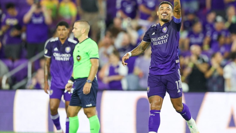 Aug 28, 2022; Orlando, Florida, USA;  Orlando City midfielder Junior Urso (11) reacts after scoring a goal against New York City FC in the first half at Exploria Stadium. Mandatory Credit: Nathan Ray Seebeck-USA TODAY Sports