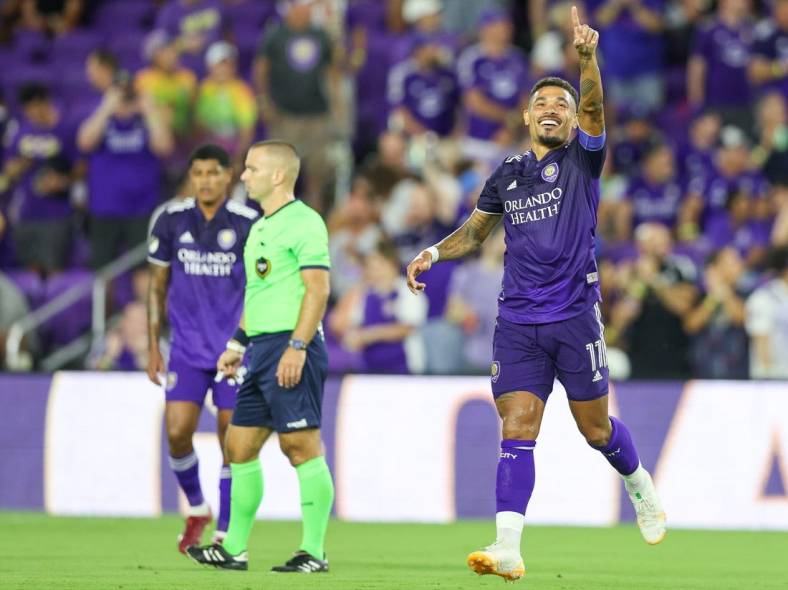 Aug 28, 2022; Orlando, Florida, USA;  Orlando City midfielder Junior Urso (11) reacts after scoring a goal against New York City FC in the first half at Exploria Stadium. Mandatory Credit: Nathan Ray Seebeck-USA TODAY Sports
