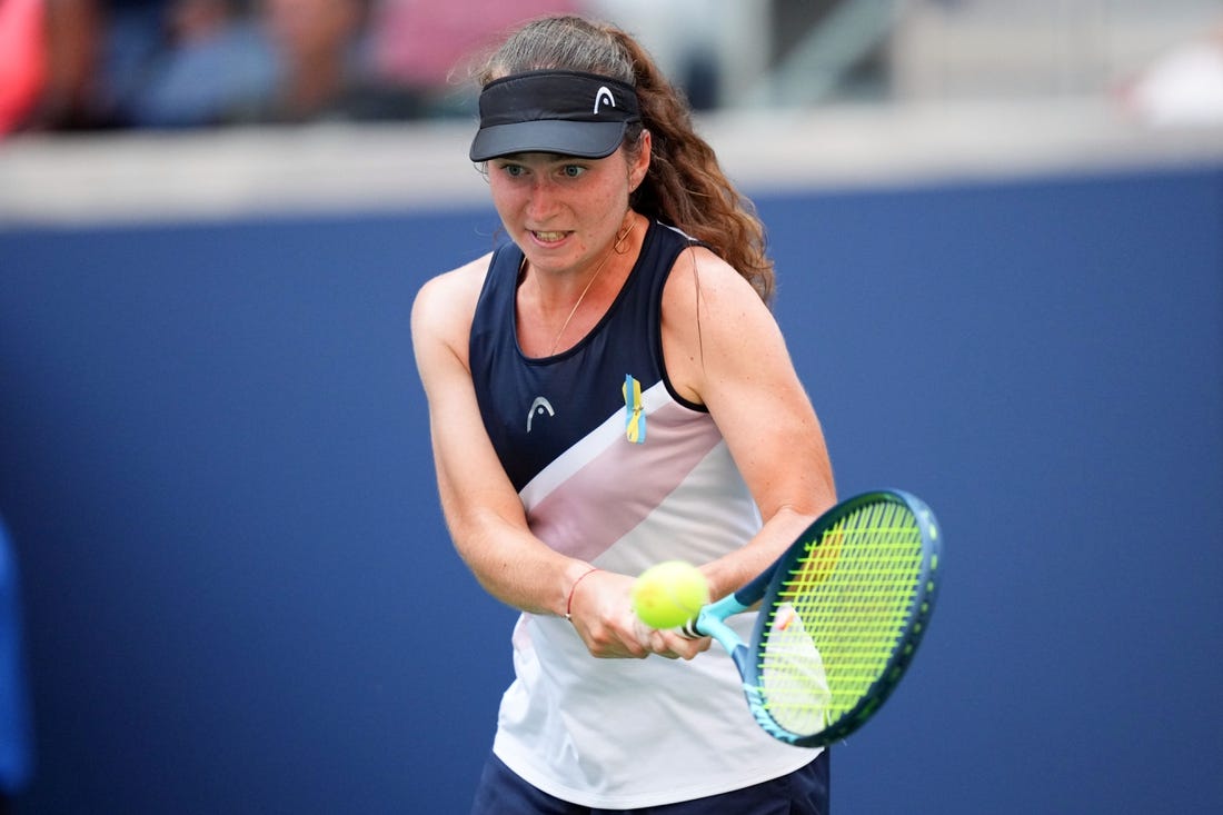 Aug 29, 2022; Flushing, NY, USA; Daria Snigur of Ukraine hits to Simona Halep of Romania on day one of the 2022 U.S. Open tennis tournament at USTA Billie Jean King National Tennis Center. Mandatory Credit: Danielle Parhizkaran-USA TODAY Sports