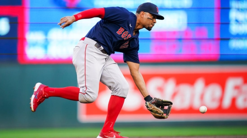 Aug 29, 2022; Minneapolis, Minnesota, USA; Boston Red Sox shortstop Xander Bogaerts (2) fields a ground ball against the Minnesota Twins in the second inning at Target Field. Mandatory Credit: Brad Rempel-USA TODAY Sports
