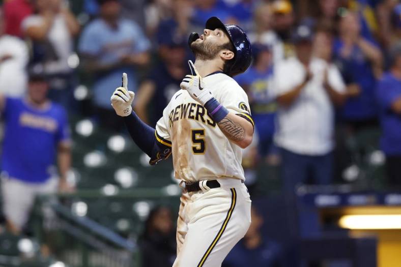 Aug 29, 2022; Milwaukee, Wisconsin, USA;  Milwaukee Brewers center fielder Garrett Mitchell (5) celebrates after hitting a two run home run during the eighth inning against the Pittsburgh Pirates at American Family Field. Mandatory Credit: Jeff Hanisch-USA TODAY Sports