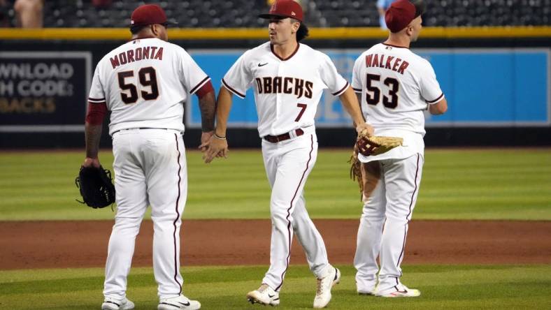 Aug 29, 2022; Phoenix, Arizona, USA; Arizona Diamondbacks right fielder Corbin Carroll (7) celebrates with teammates after defeating the Philadelphia Phillies at Chase Field. Mandatory Credit: Joe Camporeale-USA TODAY Sports