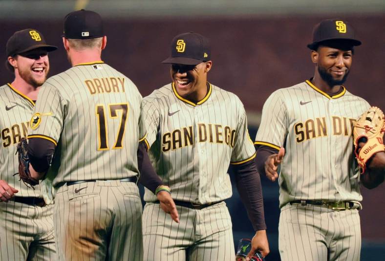 Aug 29, 2022; San Francisco, California, USA; San Diego Padres first baseman Brandon Drury (17) celebrates with right fielder Juan Soto (22) after a win against the San Francisco Giants at Oracle Park. Mandatory Credit: Kelley L Cox-USA TODAY Sports