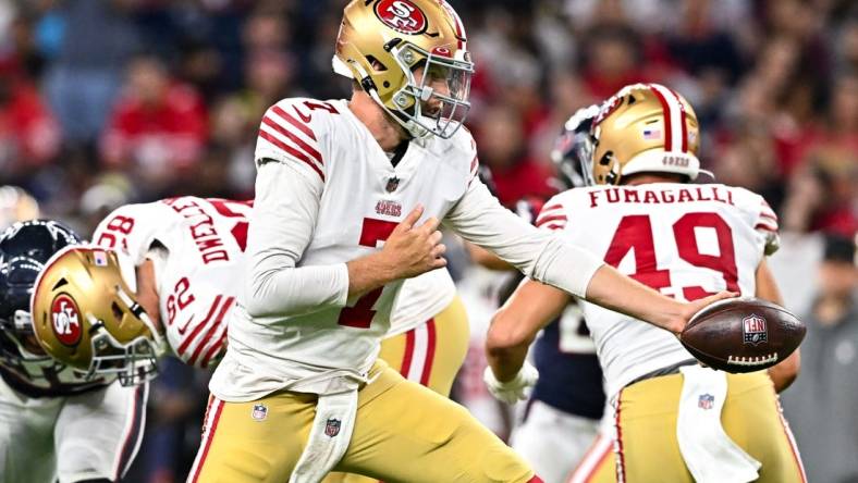 Aug 25, 2022; Houston, Texas, USA;  San Francisco 49ers quarterback Nate Sudfeld (7) looks to hand off the ball during the second half against the Houston Texans at NRG Stadium. Mandatory Credit: Maria Lysaker-USA TODAY Sports