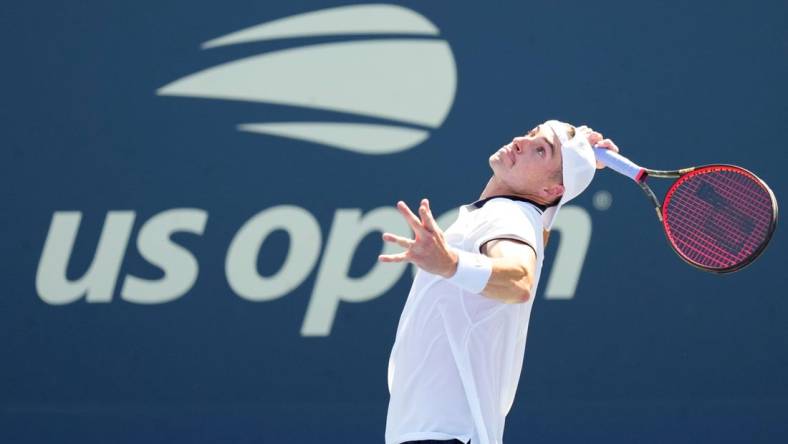 Aug 30, 2022; Flushing, NY, USA; John Isner of the United States serves to Federico Delbonis of Argentina on day two of the 2022 U.S. Open tennis tournament at USTA Billie Jean King National Tennis Center. Mandatory Credit: Danielle Parhizkaran-USA TODAY Sports