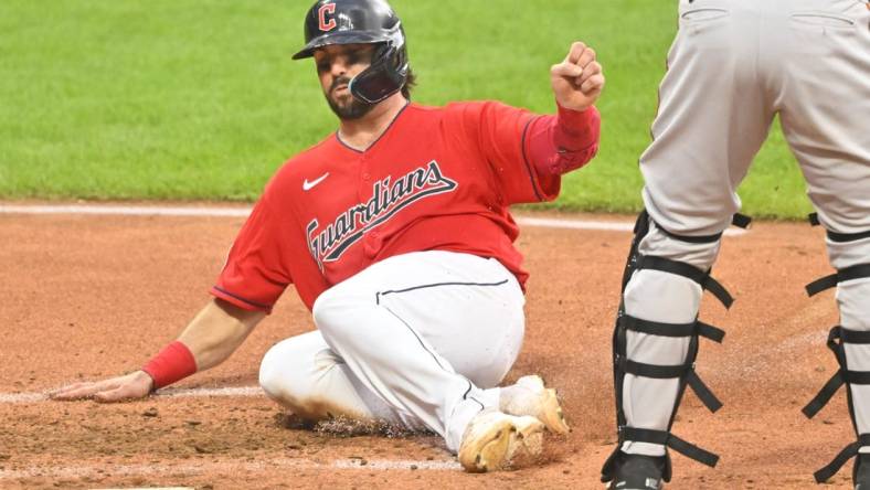 Aug 30, 2022; Cleveland, Ohio, USA; Cleveland Guardians catcher Austin Hedges (17) scores a run in the fifth inning against the Baltimore Orioles at Progressive Field. Mandatory Credit: David Richard-USA TODAY Sports