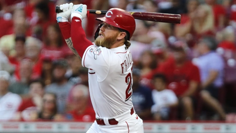Aug 30, 2022; Cincinnati, Ohio, USA; Cincinnati Reds designated hitter Jake Fraley (27) hits an RBI double against the St. Louis Cardinals during the third inning at Great American Ball Park. Mandatory Credit: David Kohl-USA TODAY Sports