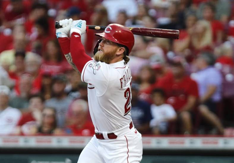 Aug 30, 2022; Cincinnati, Ohio, USA; Cincinnati Reds designated hitter Jake Fraley (27) hits an RBI double against the St. Louis Cardinals during the third inning at Great American Ball Park. Mandatory Credit: David Kohl-USA TODAY Sports