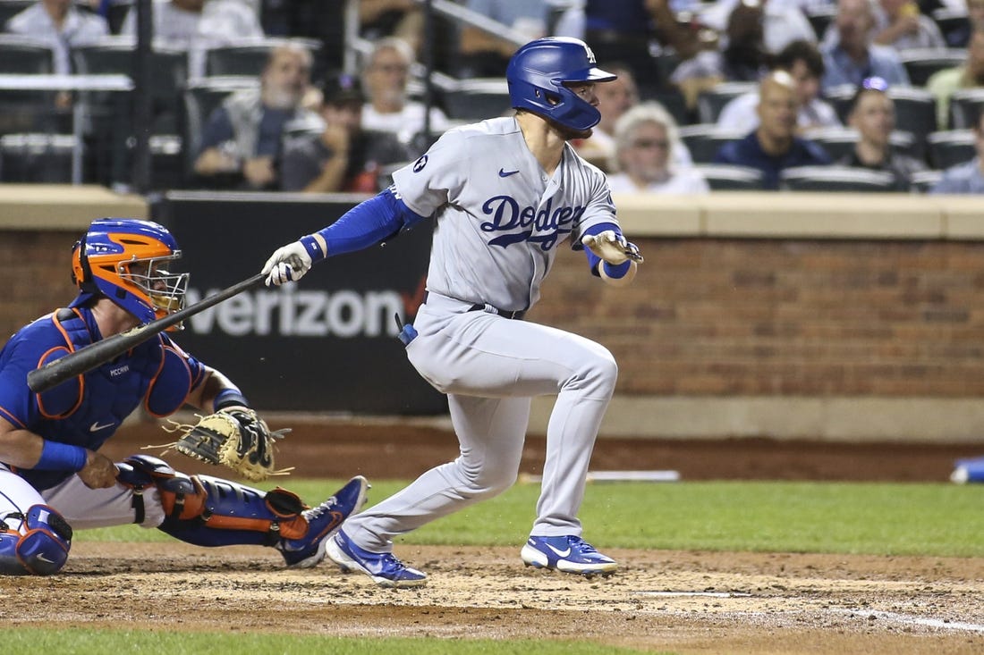 Aug 30, 2022; New York City, New York, USA; Los Angeles Dodgers second baseman Gavin Lux (9) hits a two-RBI double in the third inning against the New York Mets at Citi Field. Mandatory Credit: Wendell Cruz-USA TODAY Sports